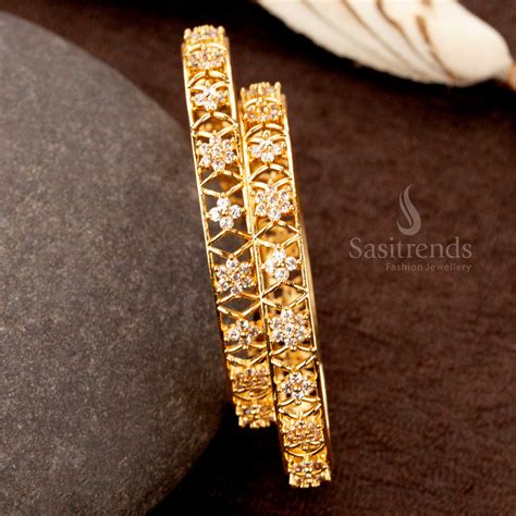 Micro Gold AD Floral Bangles with Criss-Cross Design - Sasitrends
