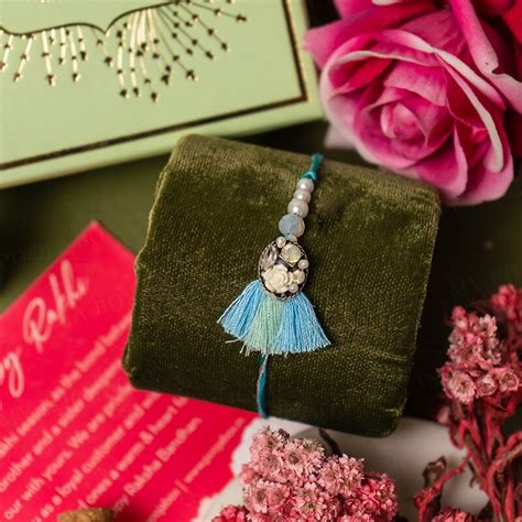 Buy Rachnaye Pastel Blue Rakhi Online in India - Mypoojabox.in