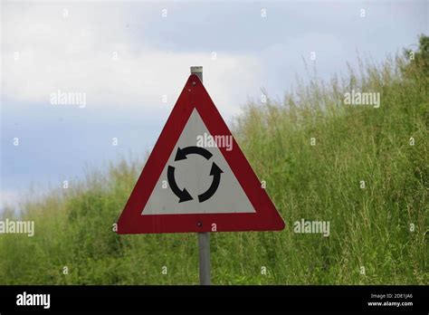 Image result for Red Triangle Roundabout Sign