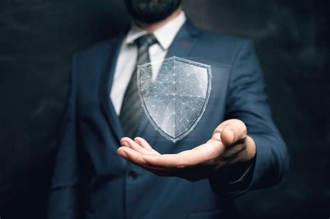 Virtual shield from the network cyber security concept man holding in ...