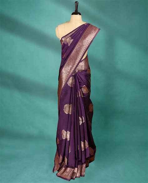 Royal Grape coloured semi silk saree featuring a Golden Zari design on