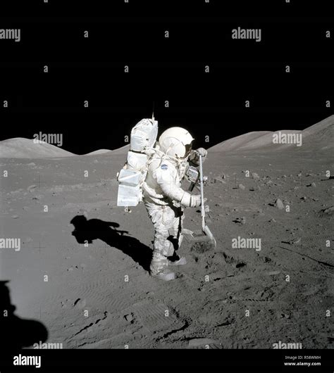 Astronaut Harrison Schmitt collects lunar rake samples during EVA Stock ...