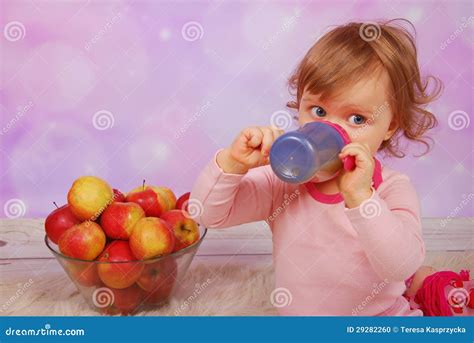 Baby Girl Drinking an Apple Juice Stock Photo - Image of fruit, bowl ...