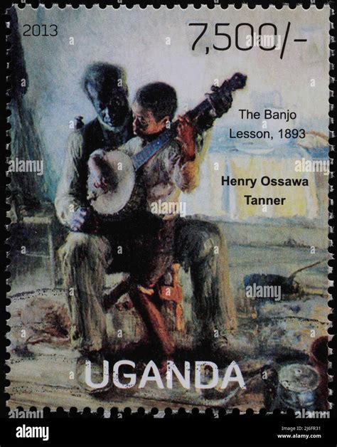 'The banjo lesson' by Henry Ossawa Tanner on stamp Stock Photo - Alamy