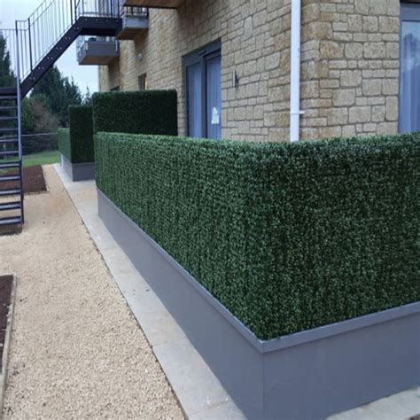 Artificial boxwood hedges for porch space divider | homify