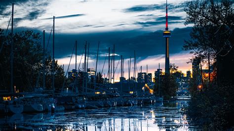 Download wallpaper 1920x1080 tower, boats, water, reflection, twilight ...