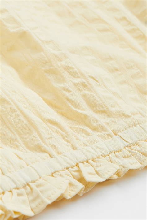 Cropped sleeveless top - Light yellow - Kids | H&M IN