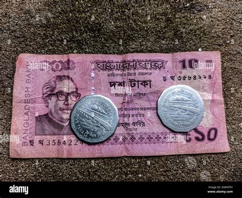 10 taka note and 5 taka coin .taka is the national currency of bangladesh Stock Photo - Alamy