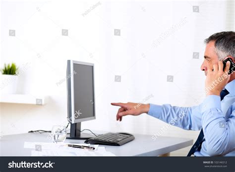 Business Man Pointing at Computer 的图像结果