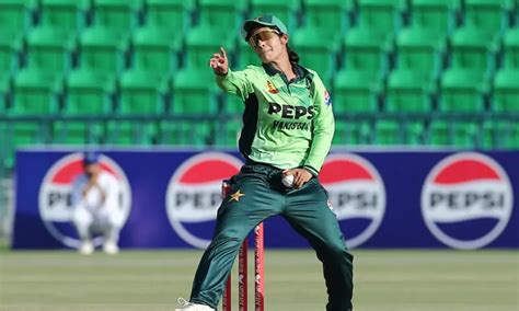 Pakistani female cricket player in fielding position