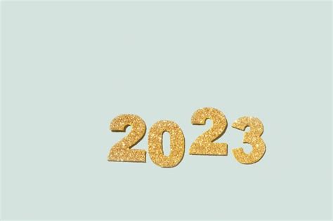 Golden glitter of the numbers 2023 is a symbol of the coming new year ...