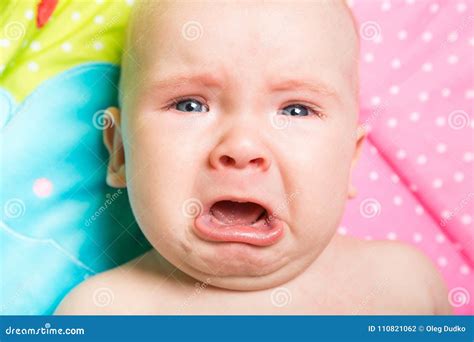 A Cute Baby Crying on a Bed Stock Photo - Image of childhood, birth: 110821062