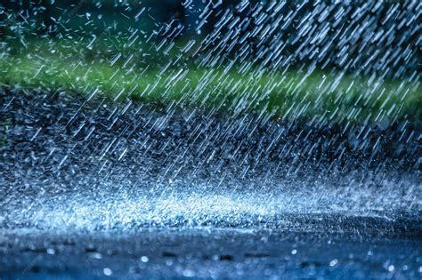 Premium Photo | Raindrops fall on the asphalt close up deterioration of weather conditions ...