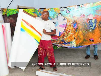 Artist Clifford Charles works on his painting at Aspin Wall Fort Kochi ...