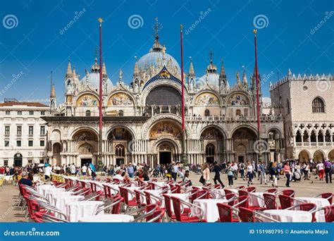 Restaurants and Tourists at the Famous Saint Mark Square of Venice in a ...