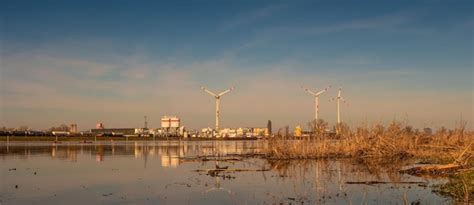Cranes in factory against sky | Premium Photo