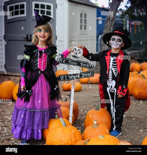 Halloween kids, Trick-or-treat. Kids wears costume of skeleton and ...