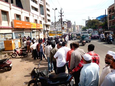People queue outside bank