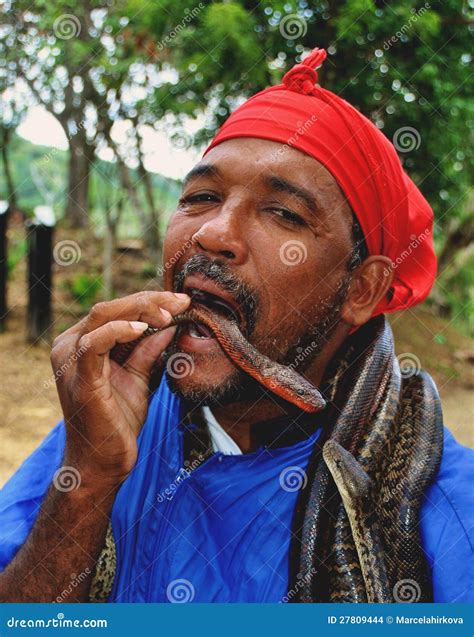 Man eating snakes editorial stock image. Image of person - 27809444