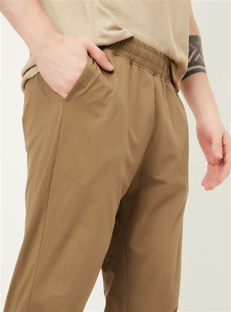 Buy Men Solid Slim Fit Track Pants Online at just Rs. 999.0 ...