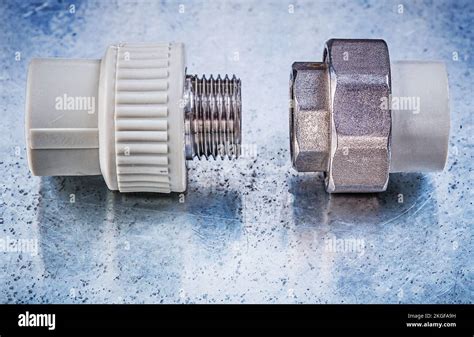 Threaded pipe connectors on metallic background construction concept ...