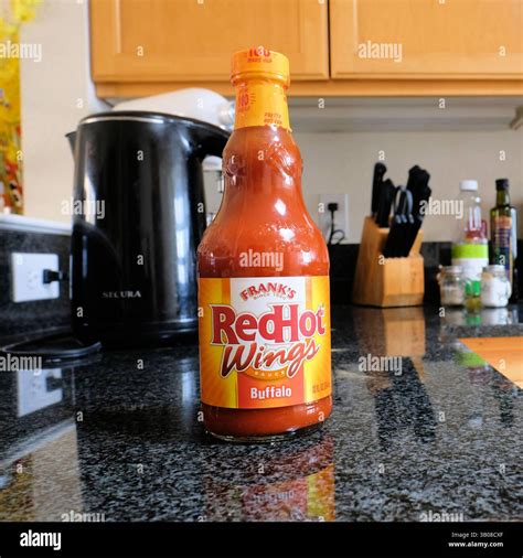 A glass bottle of Frank's RedHot Buffalo Wings Sauce on a kitchen ...