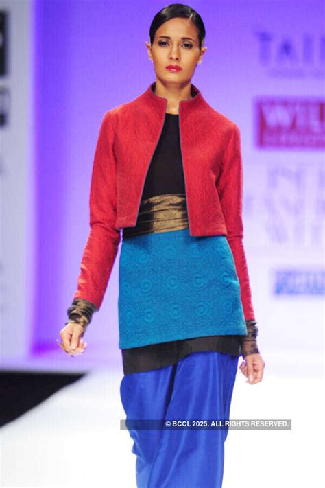 A model walks the ramp for designer Poonam Bhagat on Day 4 of the Wills ...