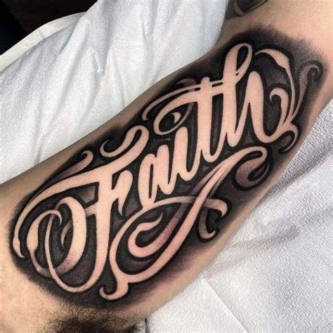 inner arm lettering tattoo
