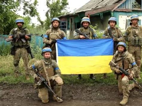 Ukrainian Flag, Dead Russian Soldiers In Village Confirm Kyiv's Biggest ...