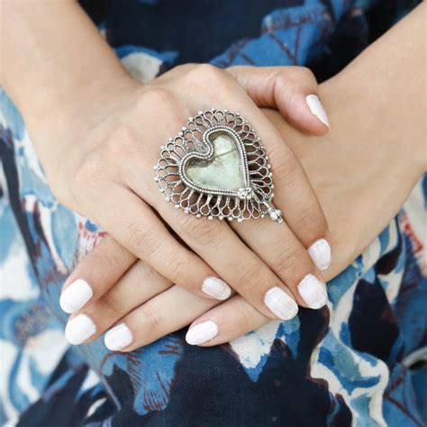 Charismatic heart shaped silver ring