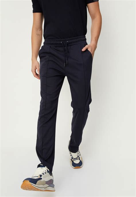 Buy Men Solid Athleisure Track Pants Online at just Rs. 999.0 ...