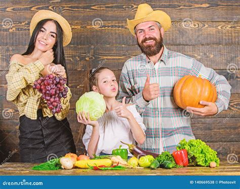 Parents and Daughter Celebrate Harvest Holiday Pumpkin Vegetables ...