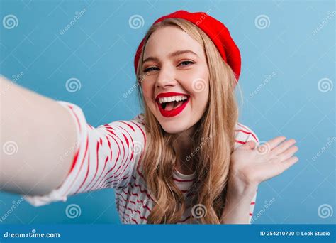 Blissful French Girl Taking Selfie with Smile. Studio Shot of Laughing ...