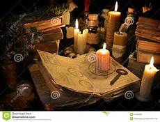 tipi di candele bloody candle on witch book in candle light stock photo tipi di candele bloody candle on witch book in candle light stock photo