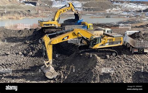 Image result for Large Excavators Loading Trucks