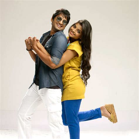 Santhanam and Ashna Zaveri in a still from the Tamil movie Vallavanukku ...