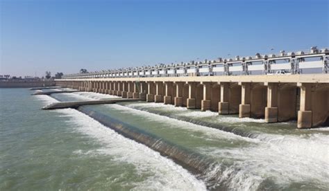 A barrage is typically constructed across a river that is flat and ...
