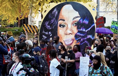 People gather at Breonna Taylors make shift memorial in Injustice Square Park in downtown Louisville