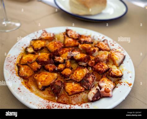 Tasty seafood, grilled octopus galician style with red pimento paprika ...