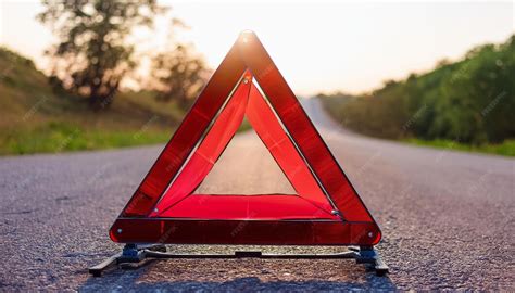Red caution warning traffic sign on wet asphalt warning of accident on ...