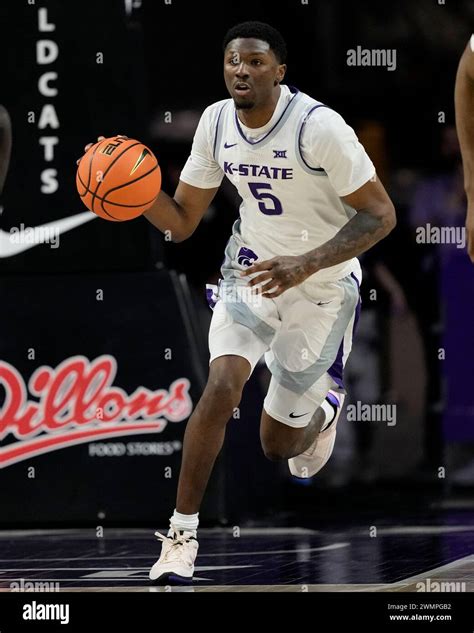 Kansas State guard Cam Carter drives during the second half of an NCAA college basketball game ...