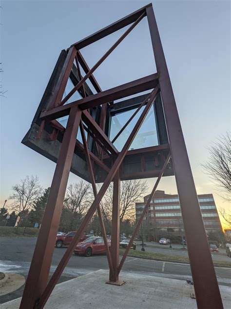 2-sided metal and glass structure (no roof or floor), about 20 feet ...