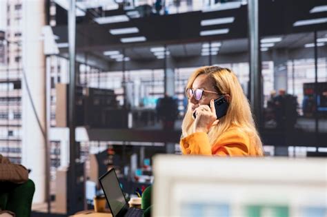 Determined businesswoman speaking on a phone call to ensure project ...