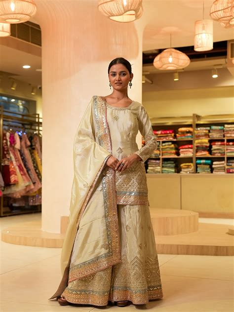 Draped in silk elegance this sharara set steals the spotlight ...