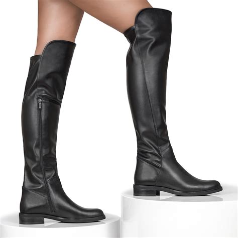 Black leather knee high top boots with a flat heels and fitted upper ...