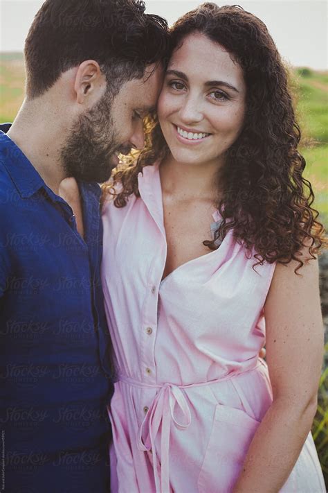 "Young Couple Together Outside Laughing And Hugging In Nature." by ...