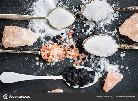 Different Kinds of Salts in Spoons — Stock Photo © MAnuta #161491282