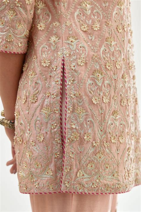 Pink short kurta set detailed with all-over zari, dori, sequins and go ...