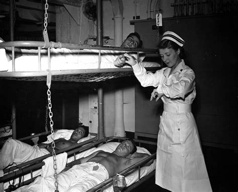 Nurse Takes Pulse of Patient on Hospital Ship – Women of World War II