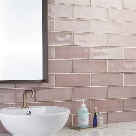 Elegance in Pink: Reflective Tiles and White Serenity in Bathroom